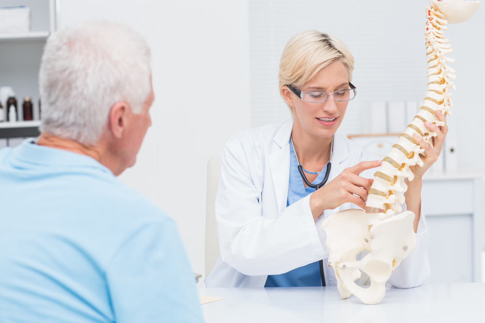 Doctor explaining spinal stenosis
